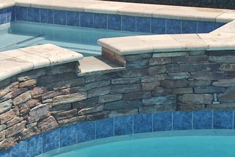 Cleaned swimming pool rock by Thomson Pool tile cleaning service