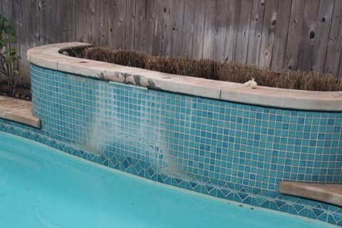 Picture of a dirty water featuring ready to be cleane by thomson pool tile cleaning service